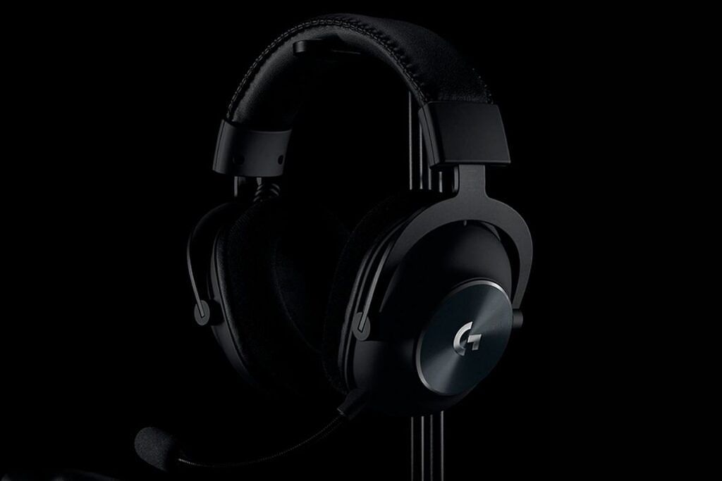 A black-colored Logitech headset kept on a stand