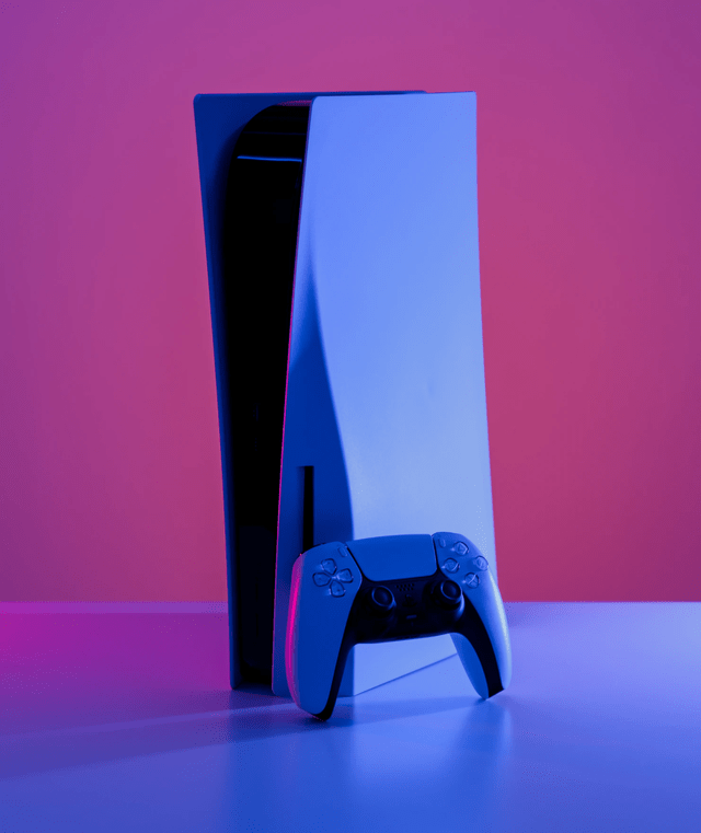 Playstation 5 console behind a pink background